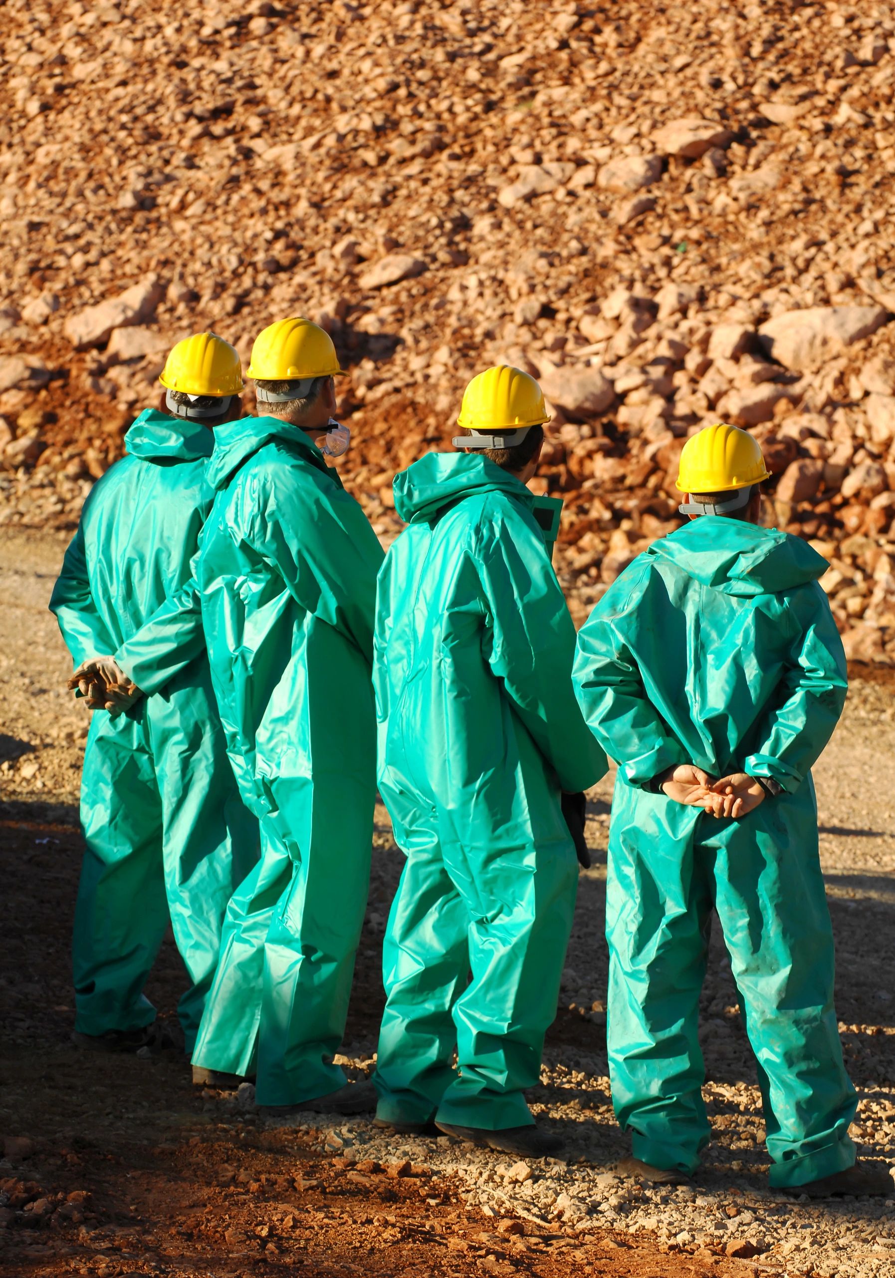asbestos abatement team in protective suits